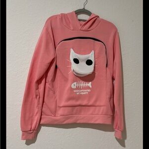 Pink sweatshirt that you can hold a small pet in.